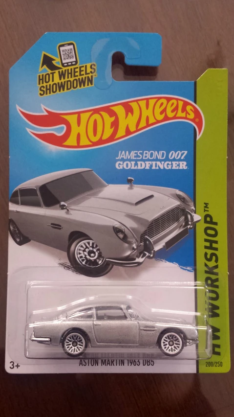 a silver car with chrome rims and wheels in the packaging