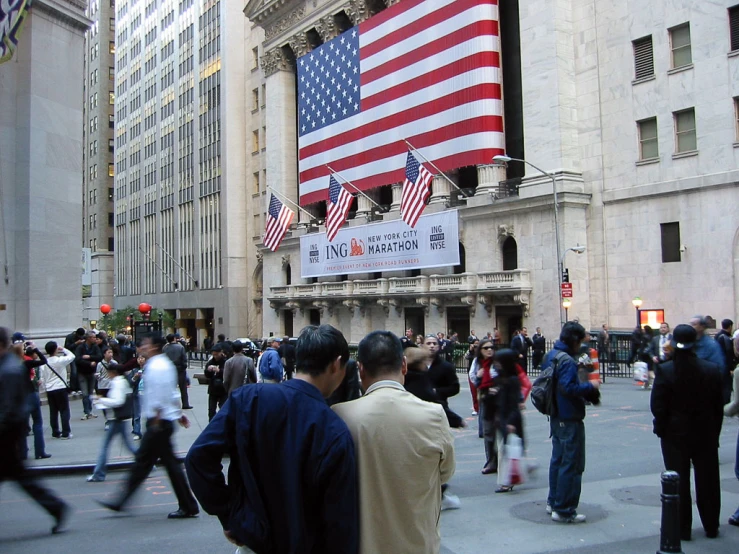 many people are walking and walking around a street