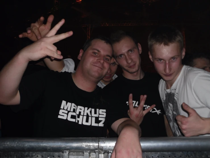 four men making the vulcan sign at a party