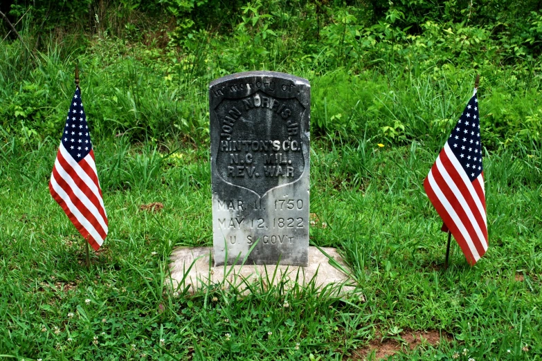 an old grave on the side of a country road