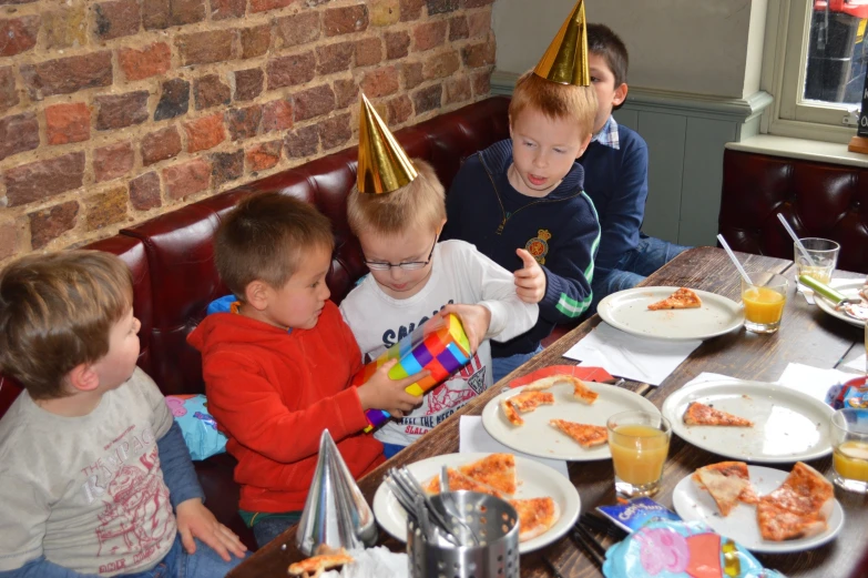 a group of s sitting at a table