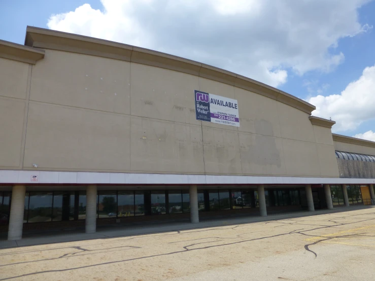 an empty building has banners on the windows