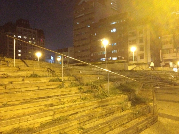 the stairs to the top of the hill are lit by street lights