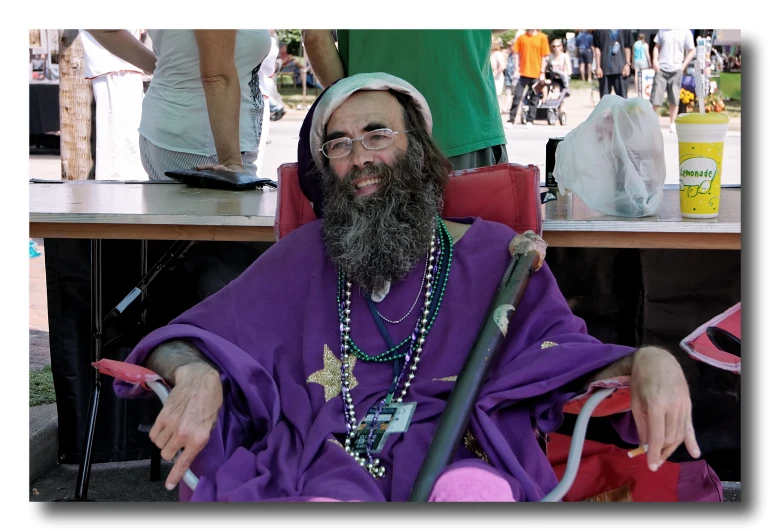 a man with long hair in a wheelchair