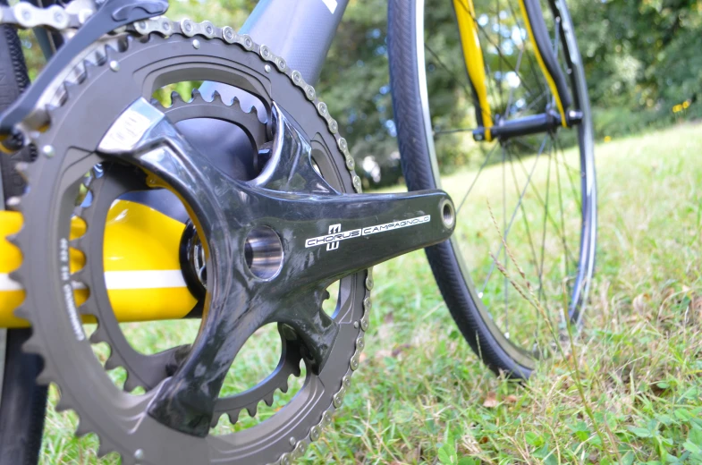 the rear end of a bike with wheels and gear on it