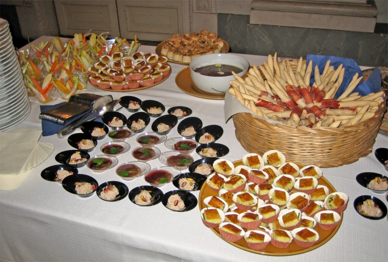 various foods and drinks on a white table