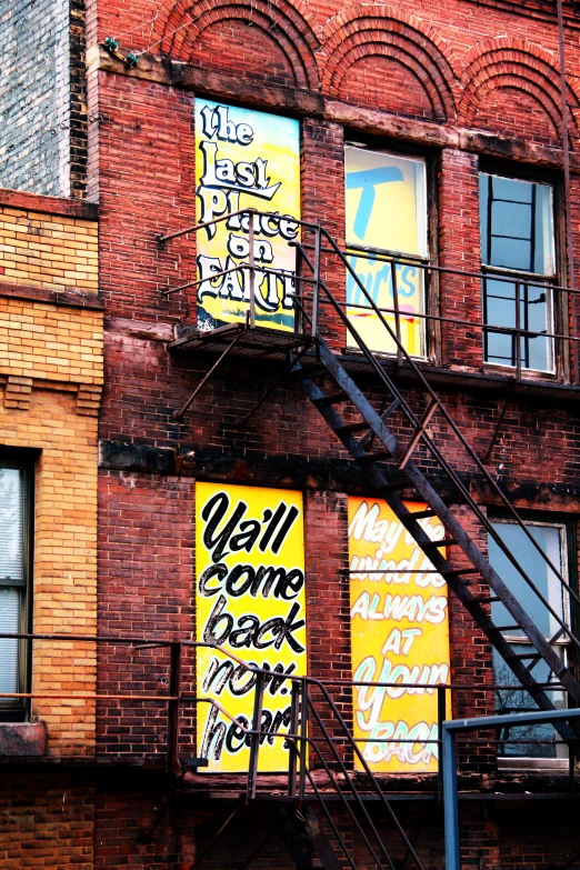 a very tall brick building with many signs