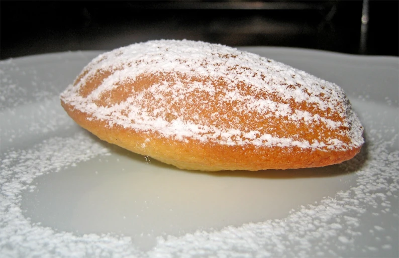 a white plate topped with powdered sugar