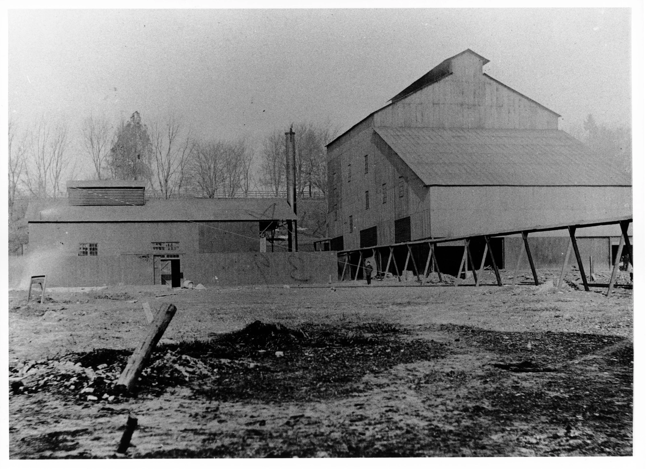 a barn is shown in black and white po