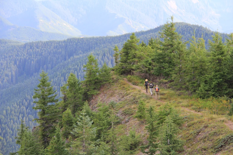 there is a hikers on the side of this mountain