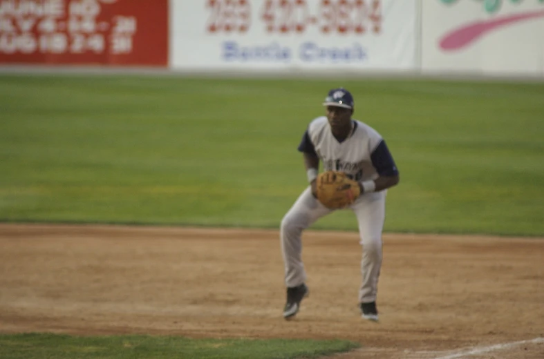 a baseball player holding a ball in one hand