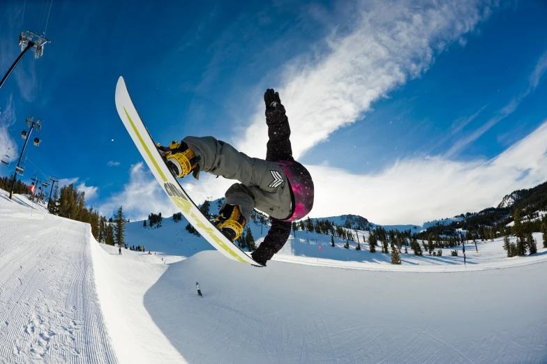 the snowboarder is in mid air after jumping