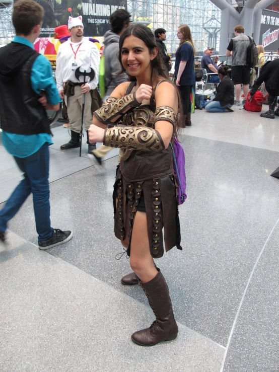 a person dressed in an armor with a snake around their arm