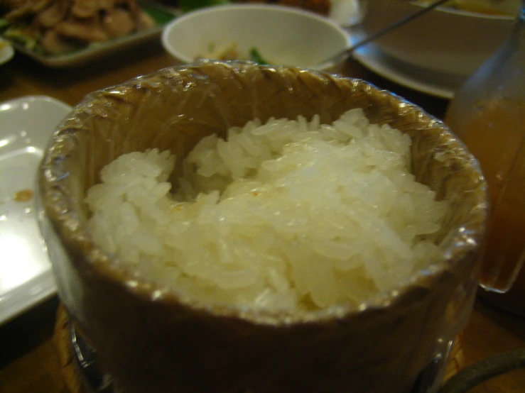 a bowl filled with rice on a table