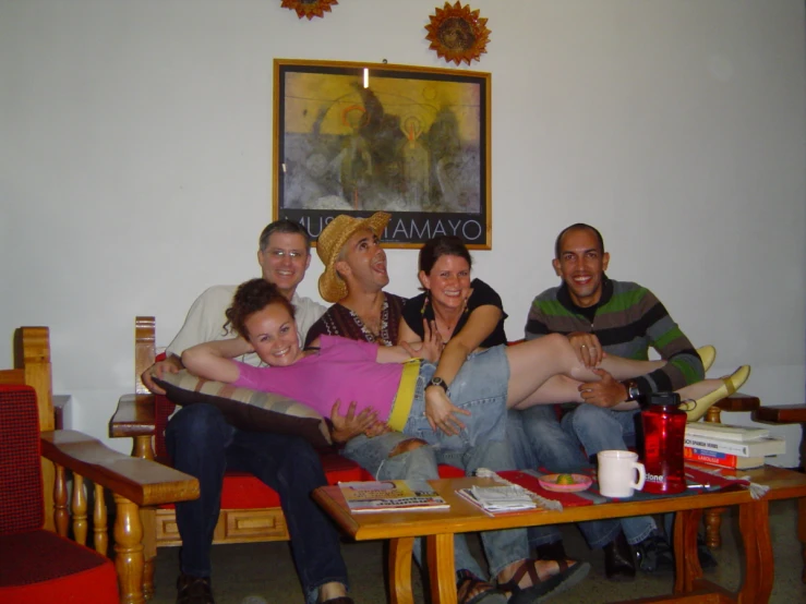 a group of people sitting around together at the table