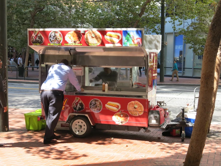 a person putting their feet on a food truck