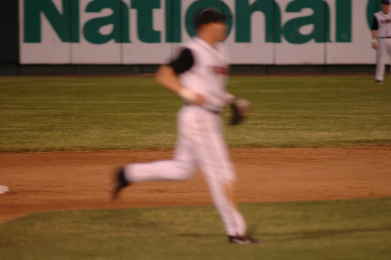 two baseball players are playing in the field