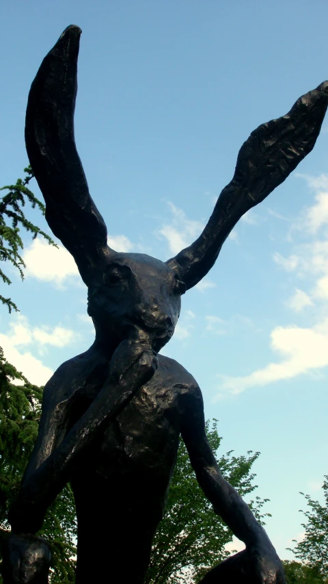 a statue of an angel carrying a staff