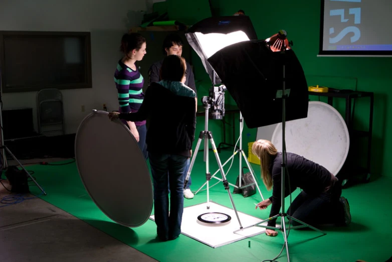 people in an industrial po studio shooting