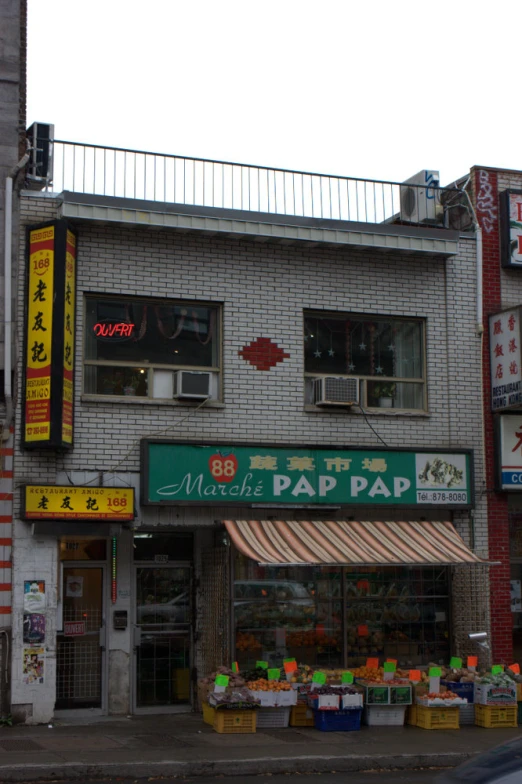 a restaurant and business on the street with sign in asian