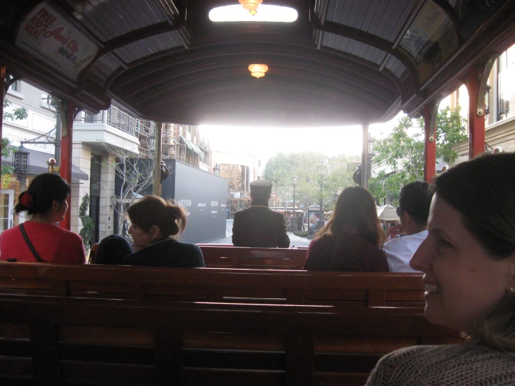 a group of people sitting in a bus next to each other