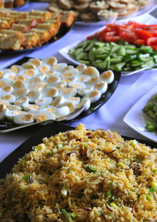 a table full of colorful food on plates