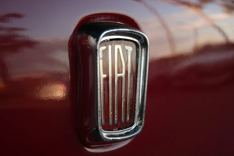 a close up of the tail end of a red car