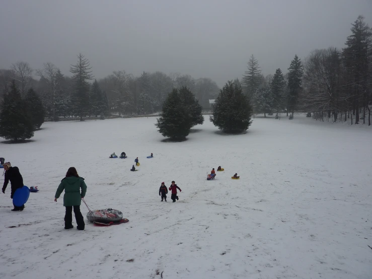 a crowd of people outside in the snow