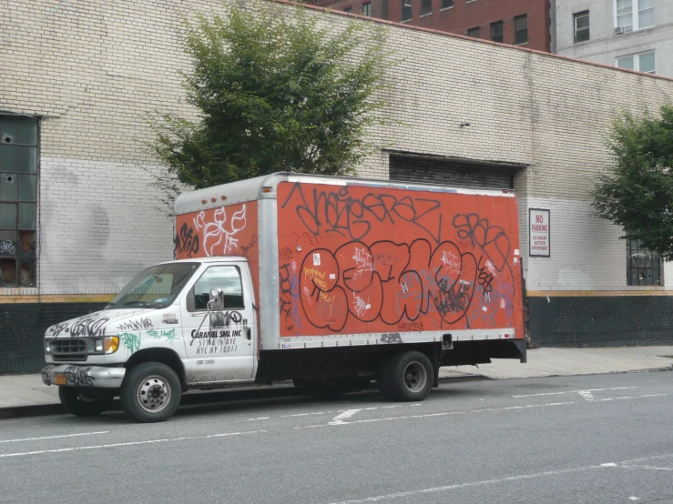 a van parked on a street with graffiti