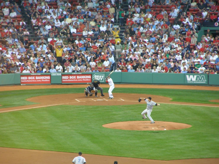 a pitcher throws the ball during a baseball game