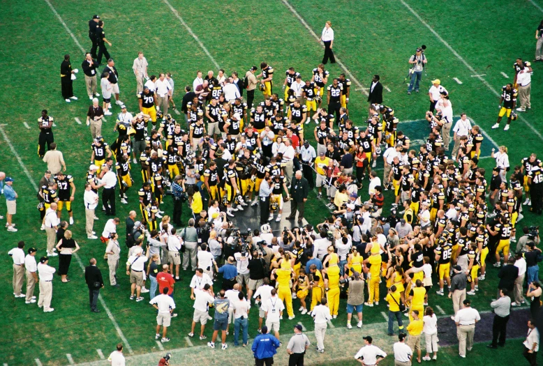 a group of people gather for a football game