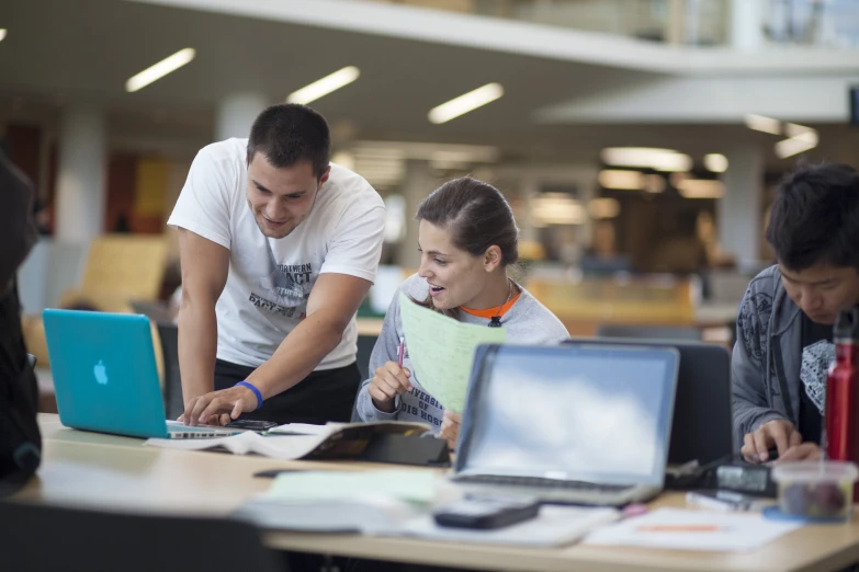 two people working on laptops on the table