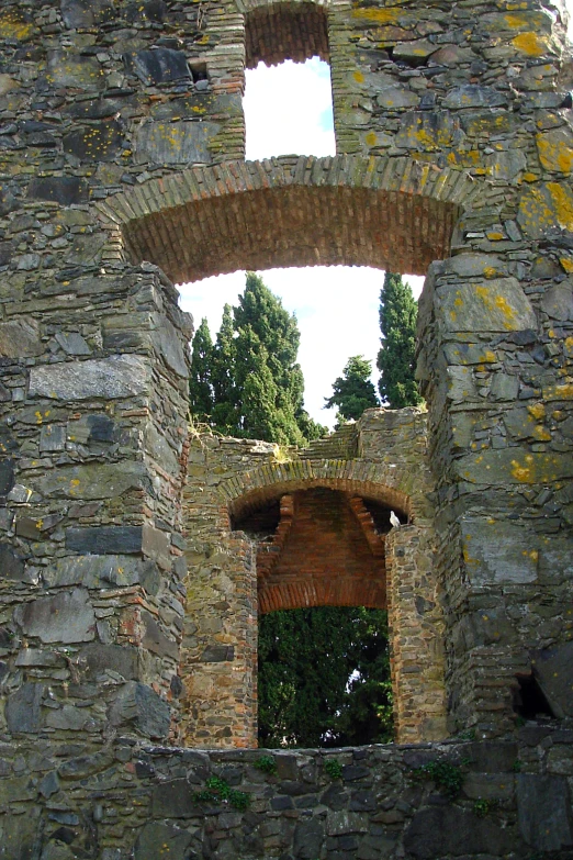 an old stone building with a doorway on top of it