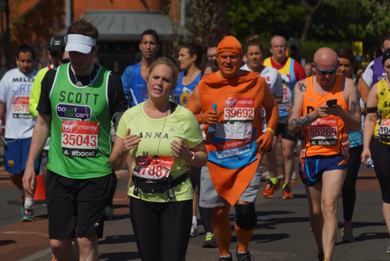 a woman in a headband and runners run through the street