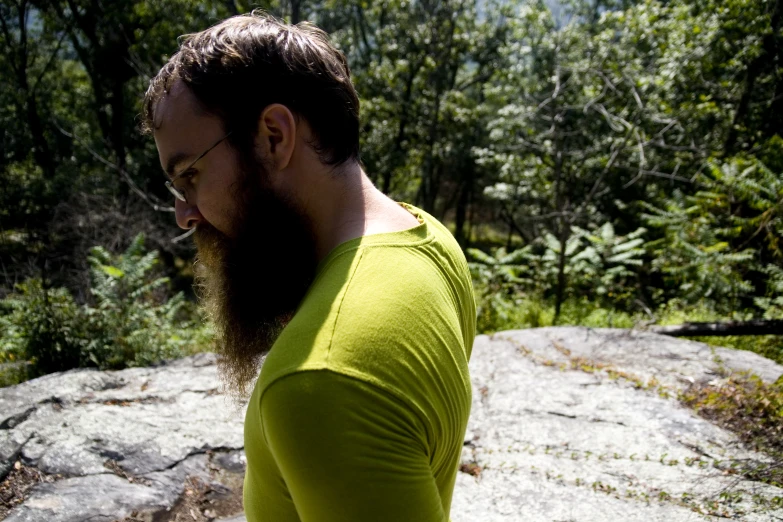 a man with a long beard in the woods