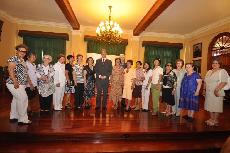 a group of women and men standing next to each other