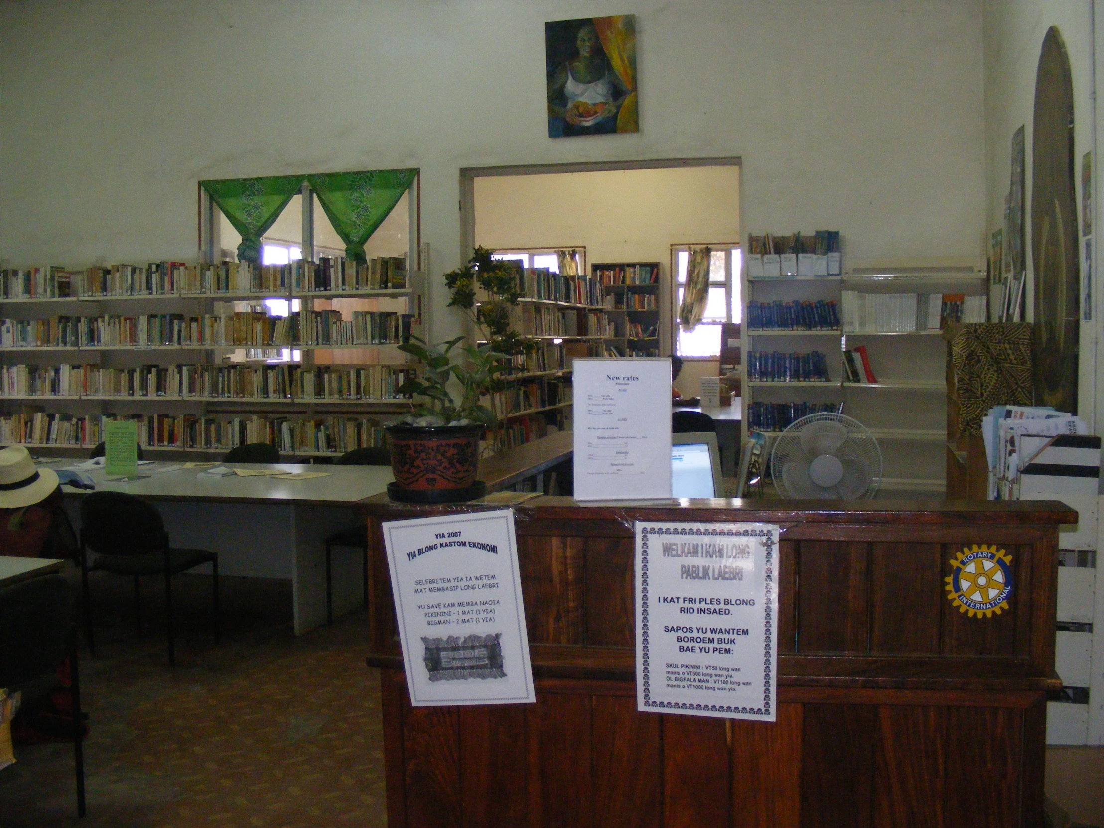 a liry with many bookshelves and tables