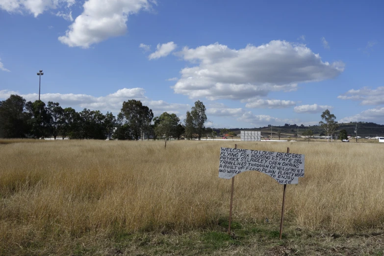 the sign is clearly visible in the empty field