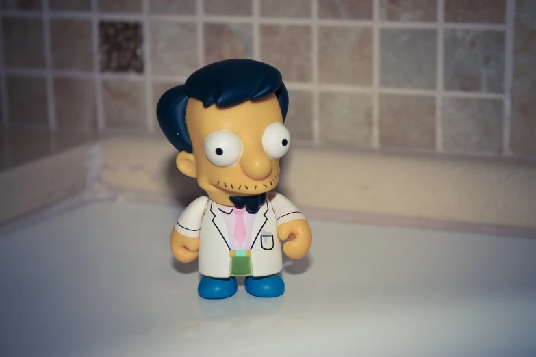 the simpsons figurine is standing in the sink