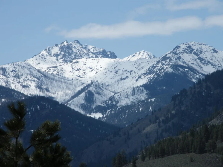 the mountains covered with snow are all around