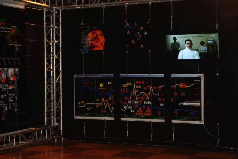 two men with electronic equipment inside a large room