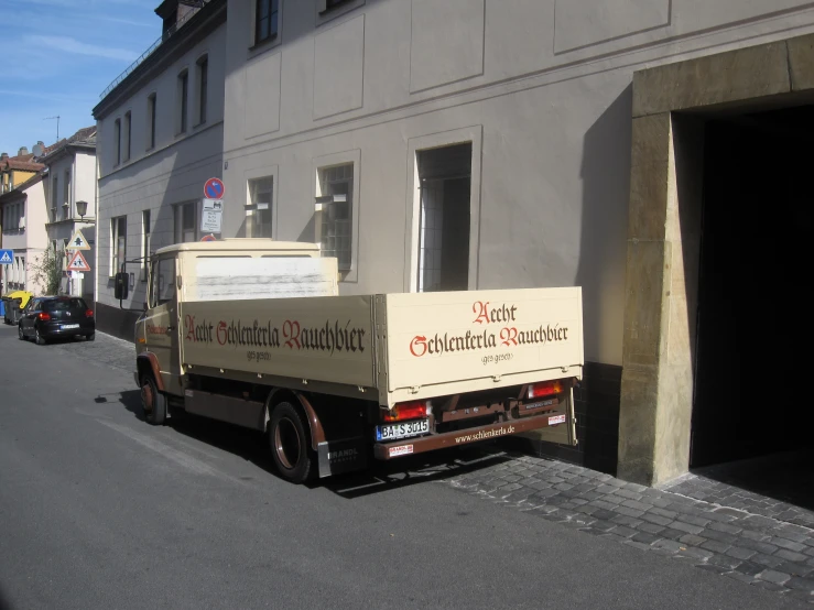 an image of a moving truck that is parked