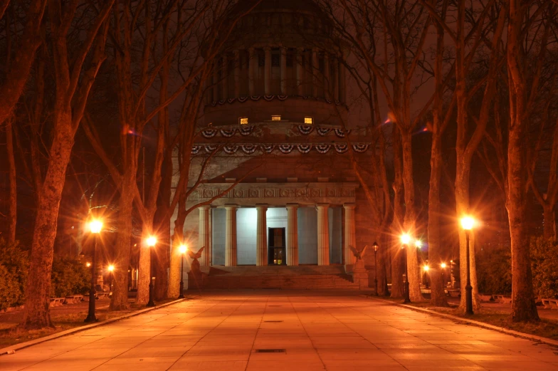 light lit trees are in front of an old building