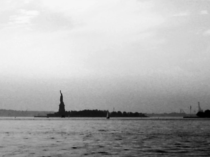 a black and white pograph of a statue of liberty