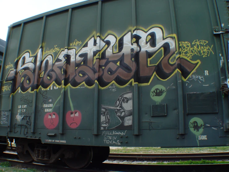 graffiti on side of train car that reads chicago