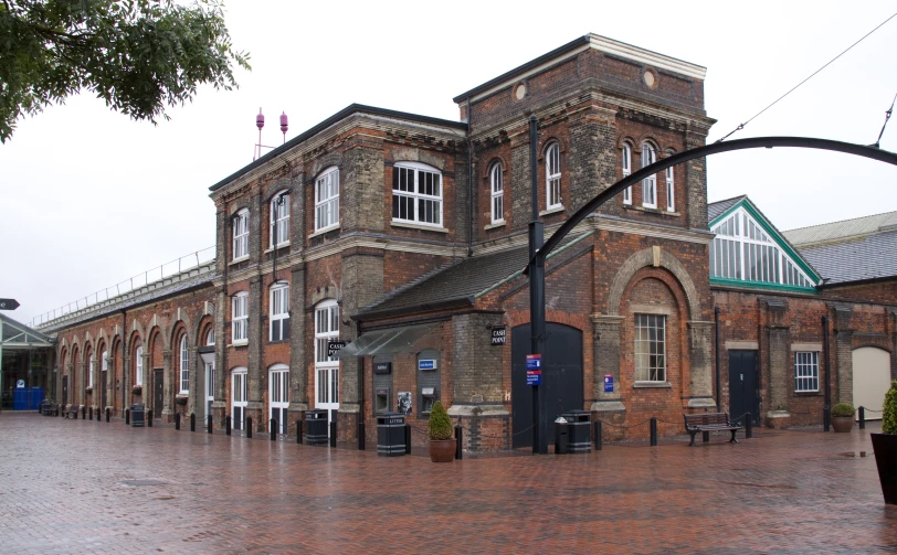 an old brick building has several windows in the front