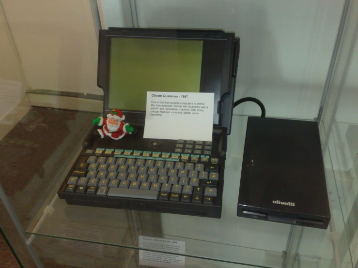 old model laptop computer with a message on it