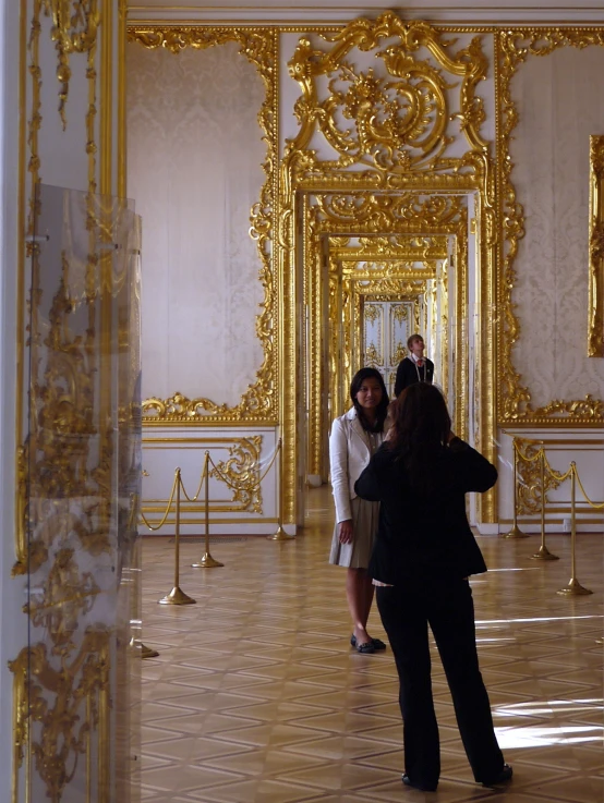 a group of people stand in the middle of a hall