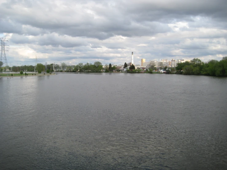 a very large body of water with a few houses near by