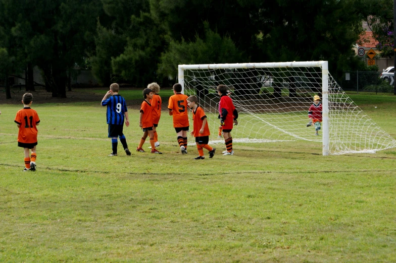 a group of young men playing soccer on a field